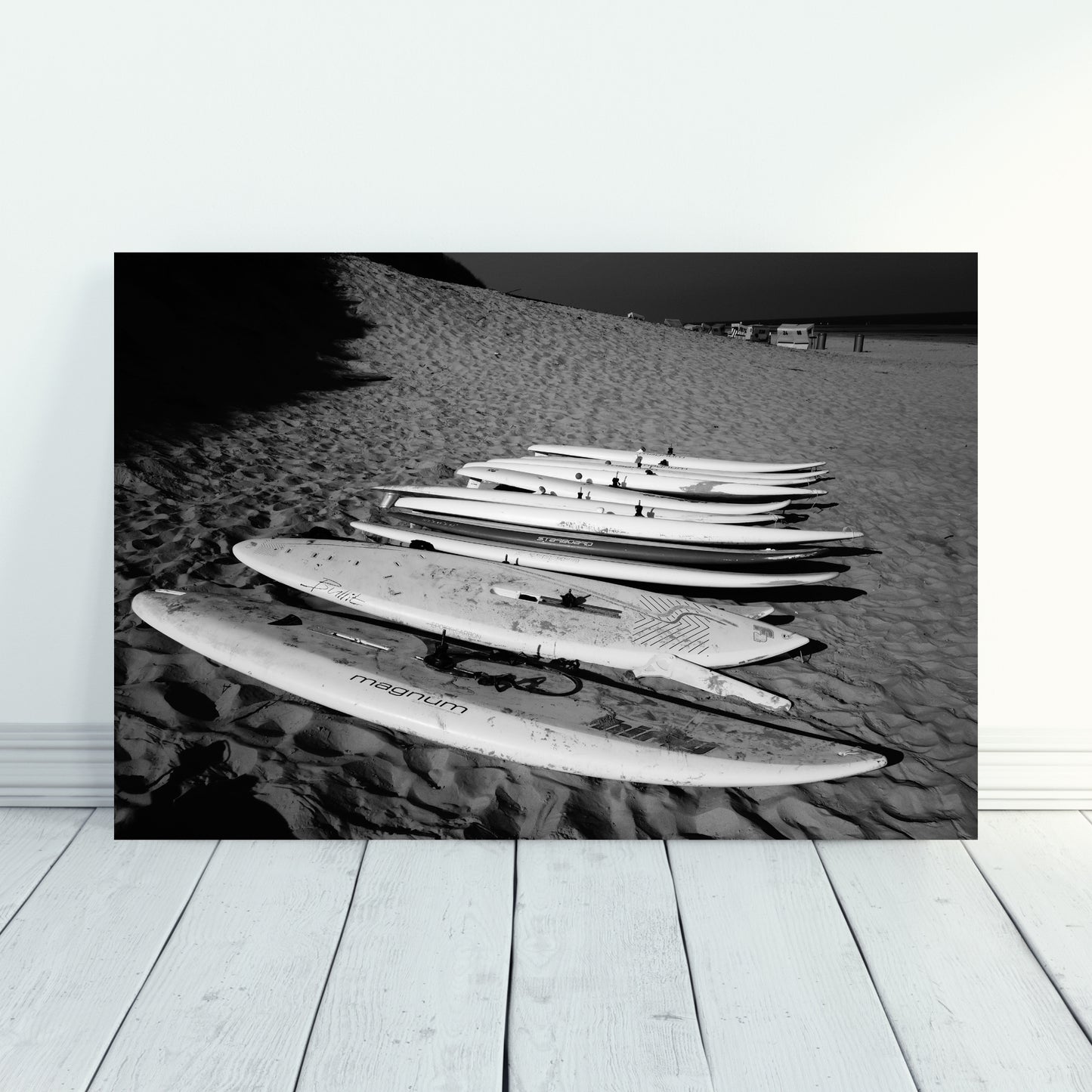 Surfboards Minimalist Black artwork showcases sleek surfboards on the beach, perfect for modern decor.