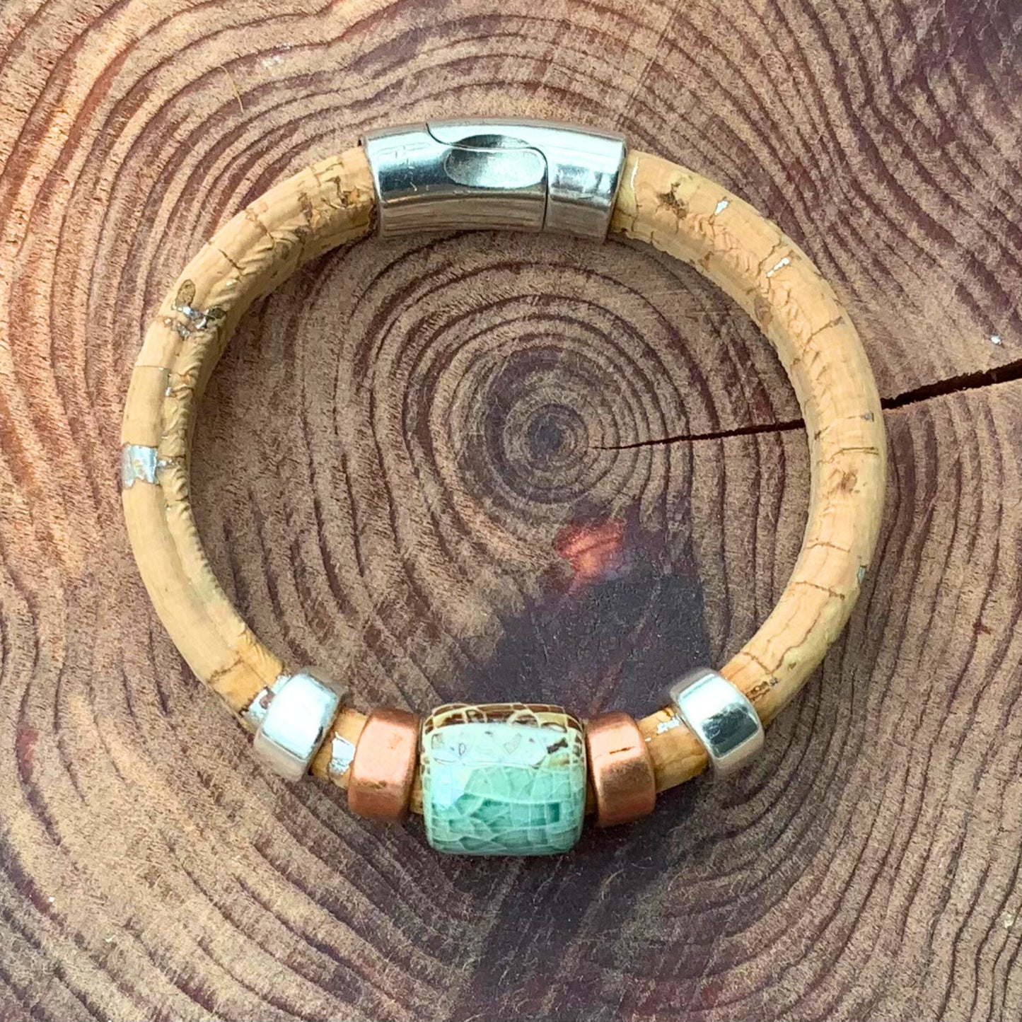 Surf & Sand Cork Ceramic Bracelet showcases vibrant blues and sandy textures for a beach-inspired look.