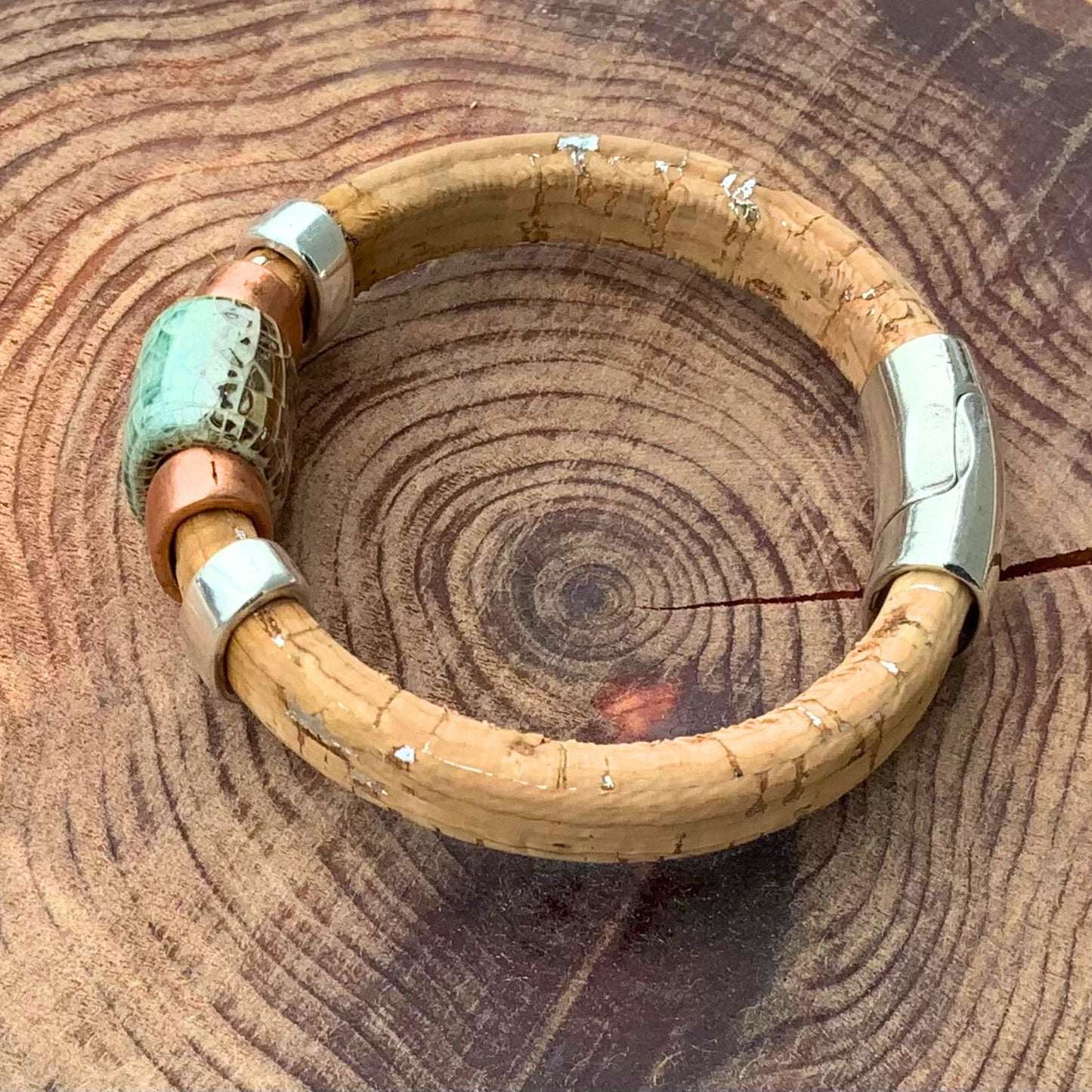 Surf & Sand Cork Ceramic Bracelet showcases earthy tones and shimmery textures, perfect for summer vibes.