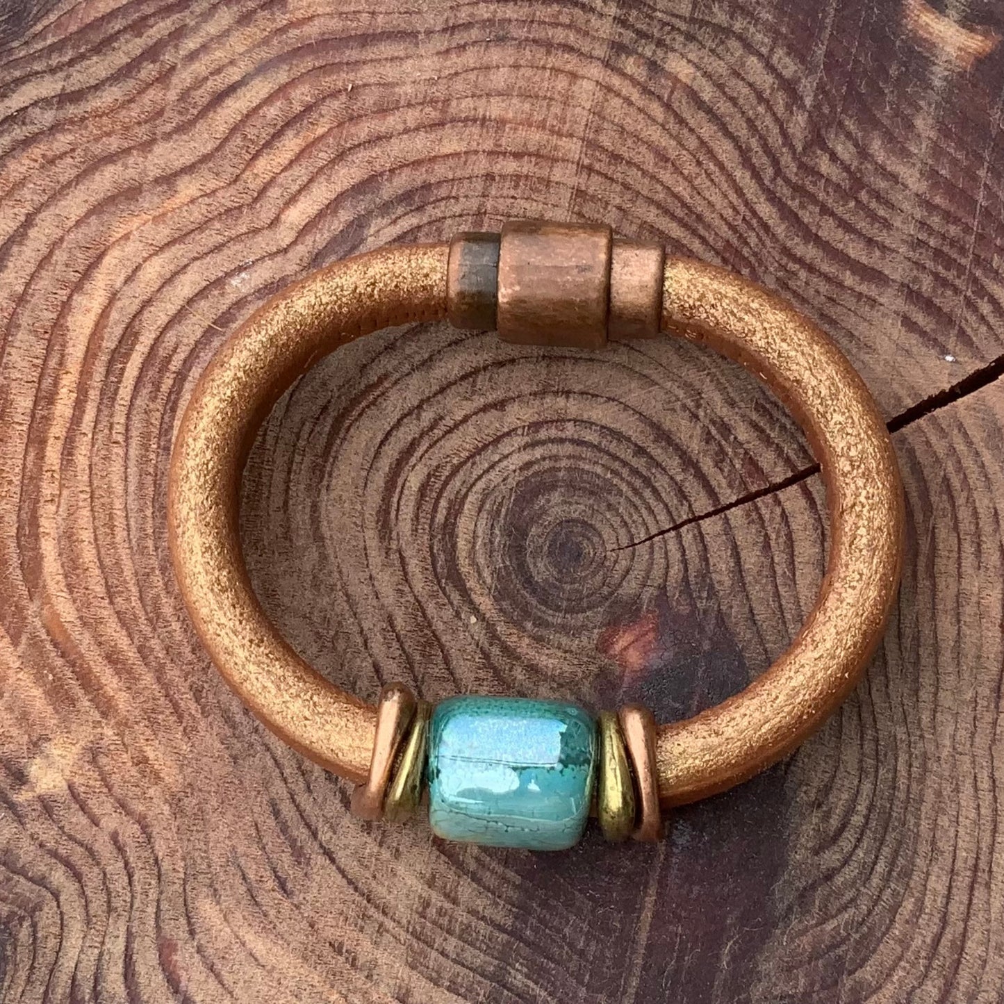 Shimmery copper leather Tuscan Sunset Ceramic Bracelet with unique glazed ceramic focal bead in blues and greens.