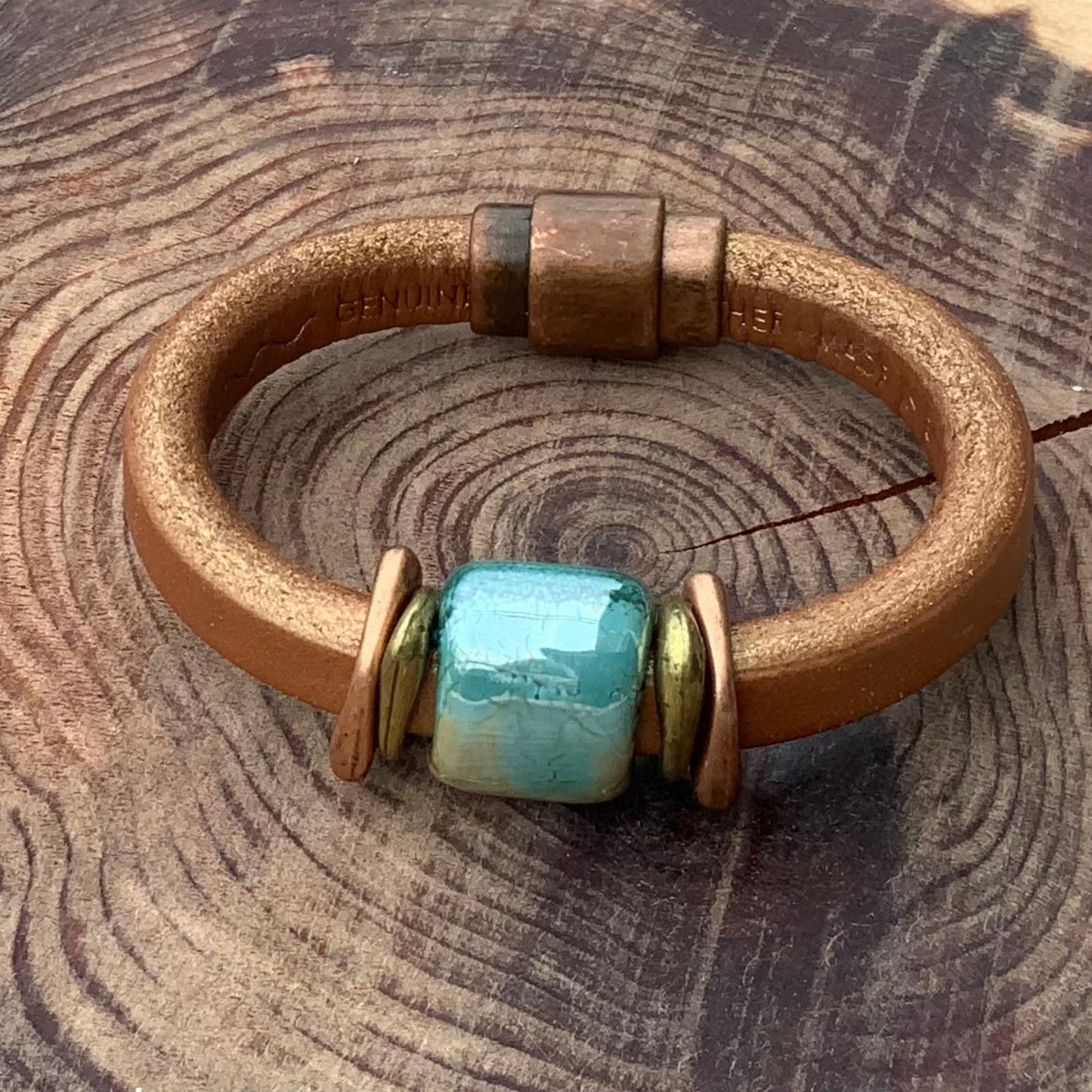 Shimmery Tuscan Sunset Ceramic Bracelet with unique glazed focal bead in blues and greens, accented with brass and copper.